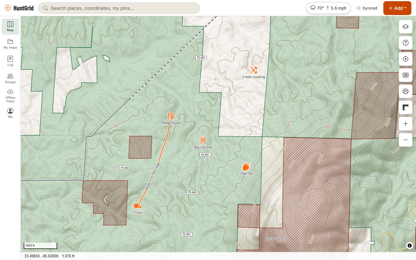 HuntGrid on a computer: a topo map of the Talladega National Forest with public land shaded green, closed areas hatched, and a hunter's stands, rub line and walk-in track.