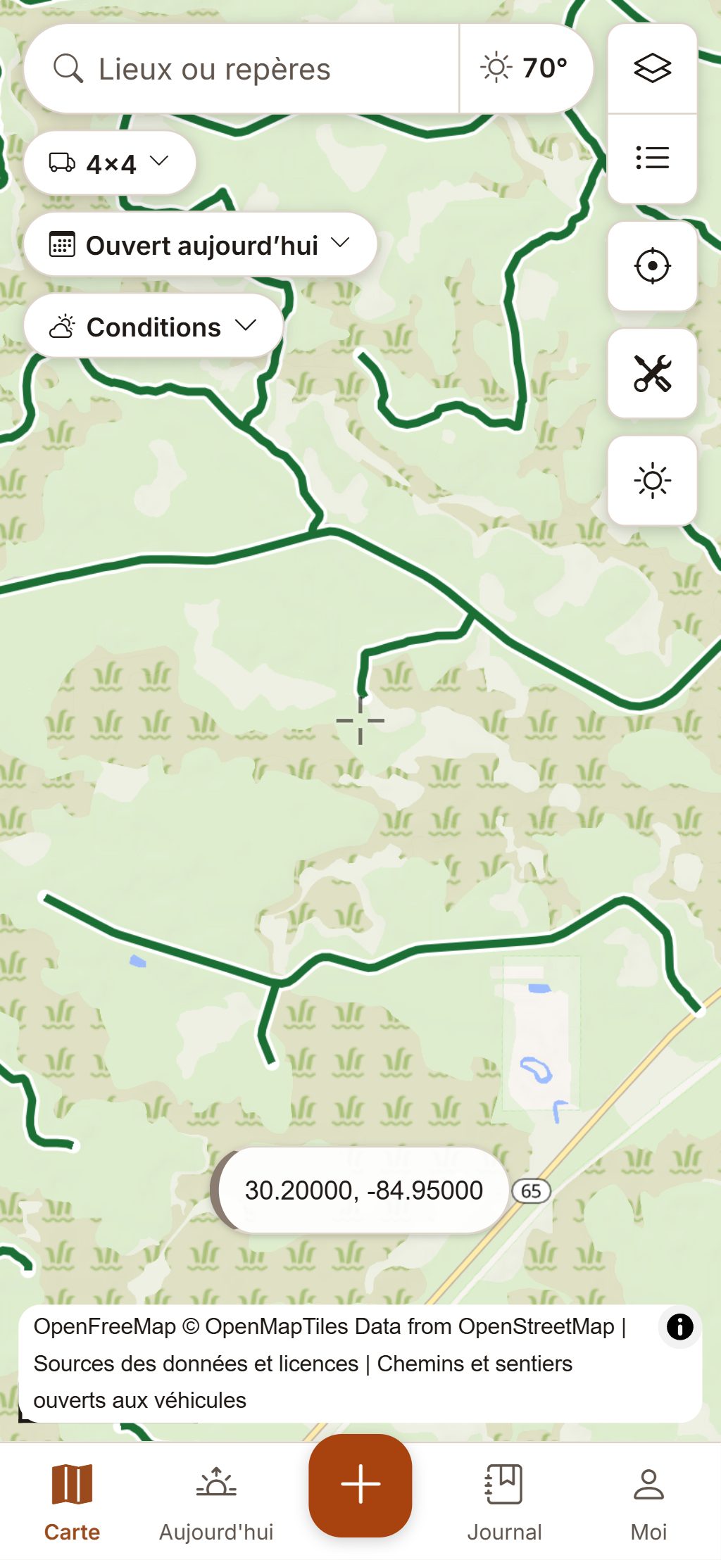 HuntGrid Hors route sur un téléphone : les chemins du Forest Service en vert là où ils sont ouverts au 4x4 du randonneur.